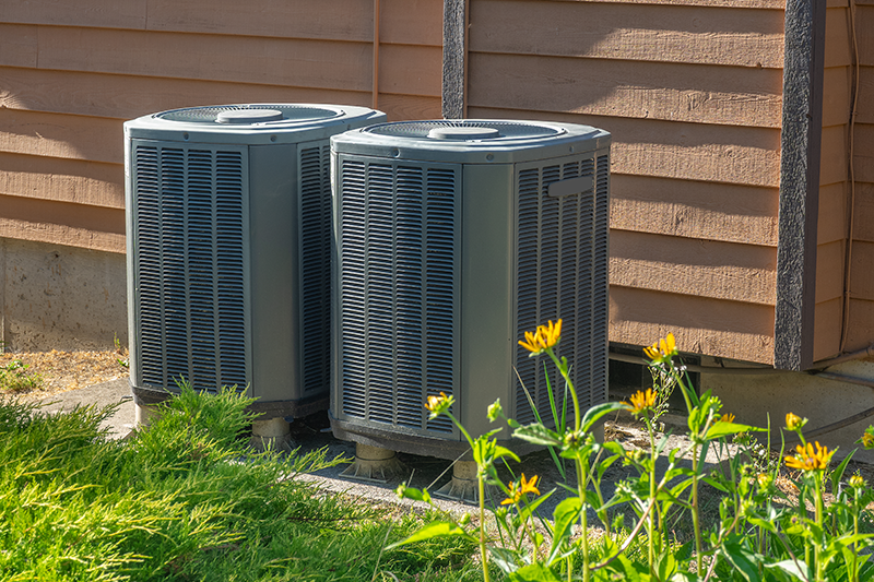 Purchasing the Right Air Conditioner - Two AC Units Outside.